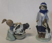 2 Lladro figurines - boy with dog and umbrella and girl washing dog