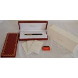 Cased Cartier Stylo Plume Mini Diablo Composite Noir fountain pen with 18ct gold nib