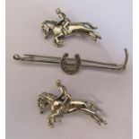 Silver riding crop and horse shoe brooch & 2 silver horse and rider brooches total weight 0.41 ozt
