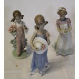 3 Lladro figurines -  girl with bird and flowers, girl with cake and girl with sun hat