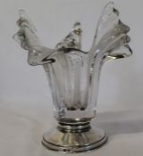 Heavy ribbed clear glass vase on circular white metal base