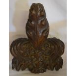 Carved wooden finial from a church pew