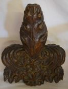 Carved wooden finial from a church pew