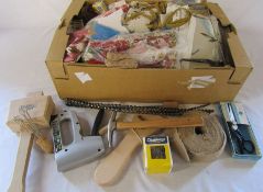 Various fabric samples and upholstery tools together with book and bag of stuffing (not shown in