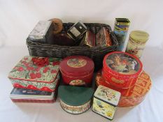 Wicker basket containing assorted vintage tins