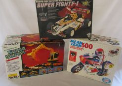 3 boxed radio controlled toys - Nikko super shovel, Taiyo Super fight F-1 and a Galoob Mean Lean