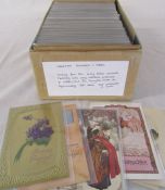 Box of assorted greetings postcards and cards dating from the early 1900s onwards featuring cats,