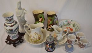 Various ceramic items including Withernsea vases, Oriental figure, German beer stein
