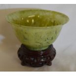 Small jadeite bowl on stand. Ht of bowl 5cm dia 10cm
