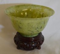 Small jadeite bowl on stand. Ht of bowl 5cm dia 10cm