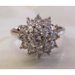 18ct white gold diamond cluster ring. Centre stone approx. 0.3ct total approx 1.3ct. Ring size P