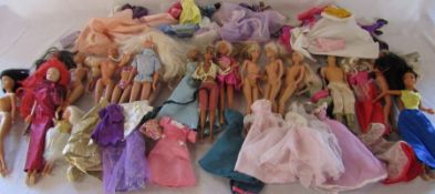 Quantity of Barbie dolls and a Ken doll with assorted clothing