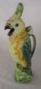 Continental ceramic jug in the form of a parrot, the handle a flower stalk H 35 cm