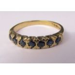 9ct gold 7 stone sapphire eternity ring size P/Q weight 2.4 g