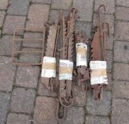 Various old cooking pot ratcheted supports and a trivet