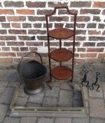 Copper helmet coal bucket, folding cake stand, small brass fender and fire dogs