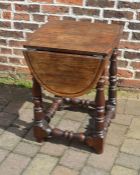 Oak oval top drop leaf table made from approximately 600 year old wood taken from the kitchen of The