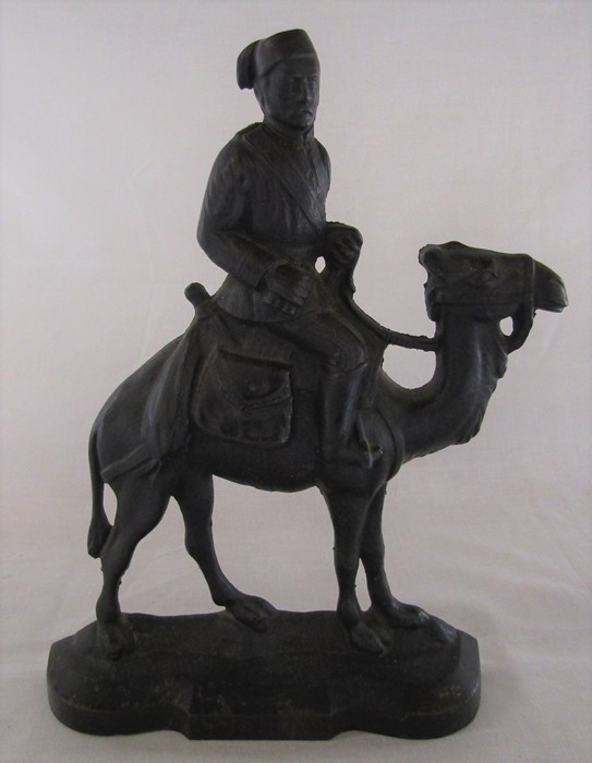 Cast iron door stop, General Gordon on a camel H 29 cm reg no 23086