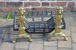 Brass and iron fire dogs and grate