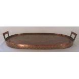 Arts & Crafts two handled copper oval tray, the rosewood base signed with a monogram and dated