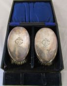 Cased pair of silver gents hairbrushes, monogrammed, Sheffield 1915