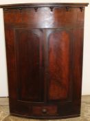 Large Georgian mahogany bow fronted corner cupboard with painted interior and frieze drawer 92cm