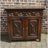 Late 17th / early 18th century oak cabinet with geometric moulding and drop handles (missing one