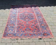 Red ground Persian style rug 226 cm x 134 cm