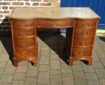 Small Georgian style walnut veneered twin pedestal desk with serpentine front  W115 D54cm