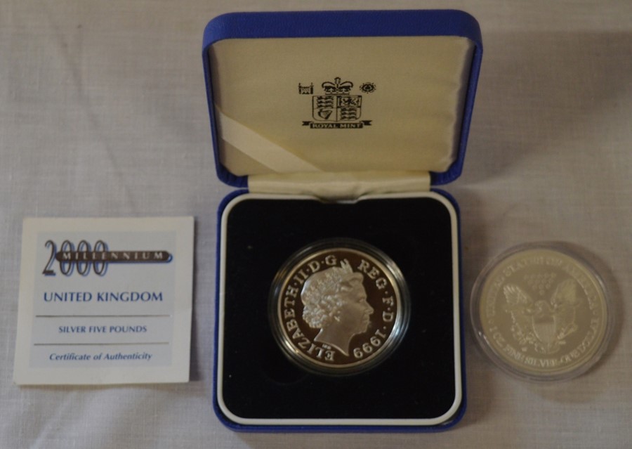 Millennium silver £5 coin & a silver 1ozt dollar