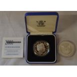 Millennium silver £5 coin & a silver 1ozt dollar