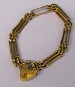 9ct gold gate bracelet and locket (one bar missing) weight 8.1 g