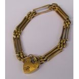 9ct gold gate bracelet and locket (one bar missing) weight 8.1 g