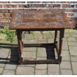 Small early 18th century oak table with carved top