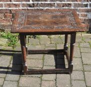 Small early 18th century oak table with carved top