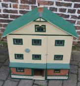 Large dolls house with a collection of furnishings