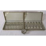 2 cased sets of 12 Dutch silver teaspoons and cake forks and a white metal tea strainer (weight