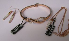 Swarovski crystal bangle, drop earrings and pendant with chain in a rose gold effect finish