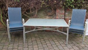 Glass topped patio table and 6 chairs