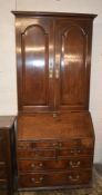 Early Georgian oak bureau with later bookcase over AF