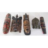 Various wooden tribal style wall masks