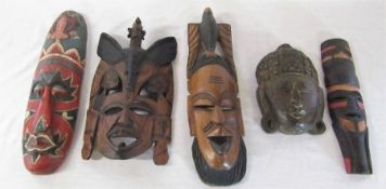 Various wooden tribal style wall masks