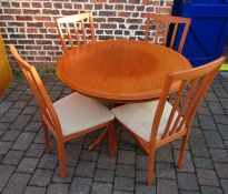 Circular draw leaf dining table and 4 chairs