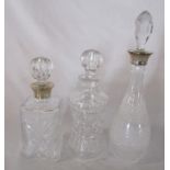 3 cut glass decanters, 2 with silver collars H 39 cm, 30 cm and 28 cm