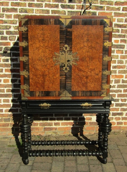 Waring & Gillow early 20th century cabinet on ebonised stand with coromandel & burr walnut veneer
