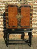 Waring & Gillow early 20th century cabinet on ebonised stand with coromandel & burr walnut veneer