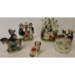4 nineteenth century Staffordshire figures including lovers in bower, figure group with dog and