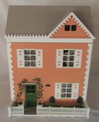 Dolls house complete with conservatory and potting shed/greenhouse, wired for lighting, extensive