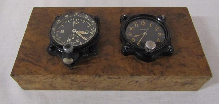 2 dashboard clocks inc Elgin 8 days mounted on a burr walnut block L 21.5 cm