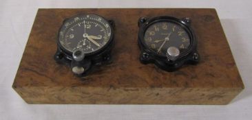 2 dashboard clocks inc Elgin 8 days mounted on a burr walnut block L 21.5 cm